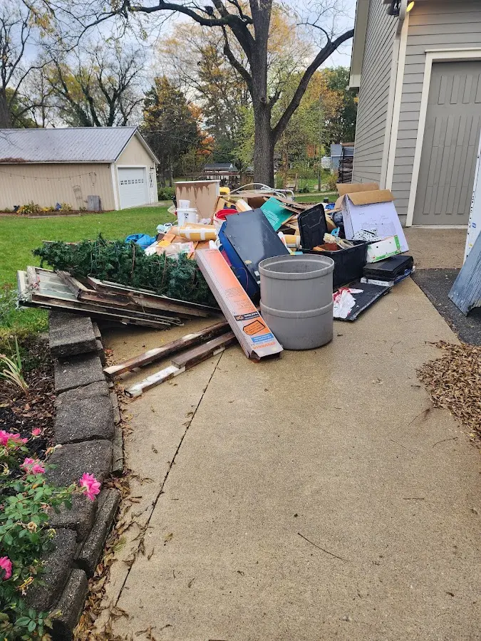 Dumpster being loaded with debris for Residential Dumpster Rental in Belgrade